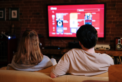 Couple on the couch watching TV