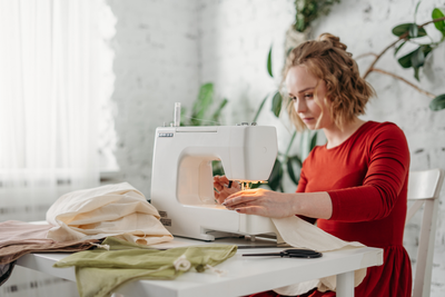 Women sewing while sitting on a chair