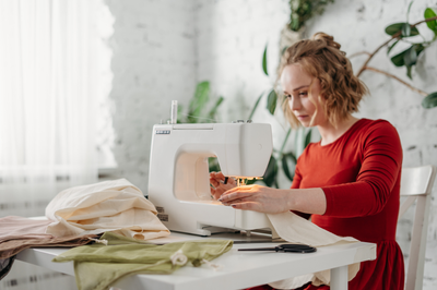 Women sewing while sitting on a chair